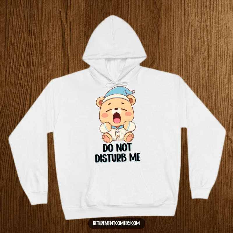 Funny sleepy bear in pajamas and a nightcap lets out a huge yawn on this plush hoodie, perfect for relaxation.