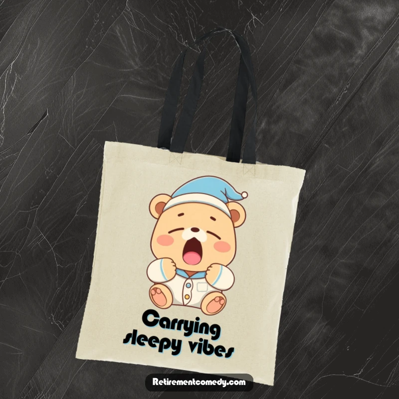 Funny sleepy bear in pajamas and a nightcap yawns widely on this tote bag, representing comfort and leisure.